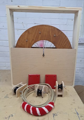 Components of home dumbbell with Red metal brakets and red, red and while sally, before shiiping to Canada.